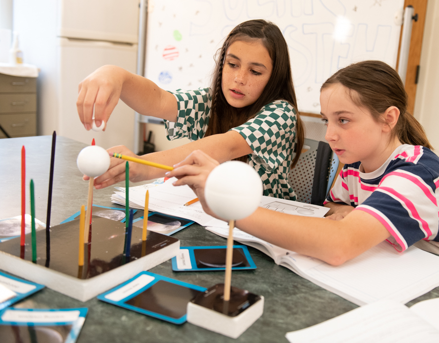 students work with moon phases model