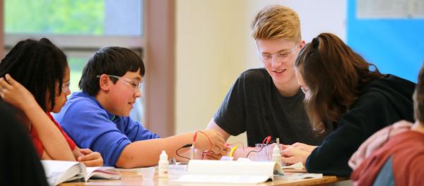 high school students around a table Thumbnail